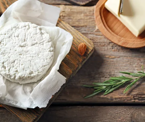 Goat cheese on a cutting board.